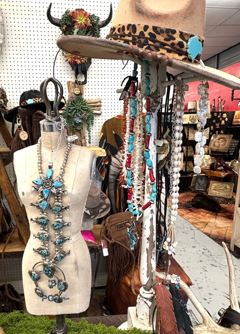 Mannequin styled with turquoise squash blossom necklace and hat
