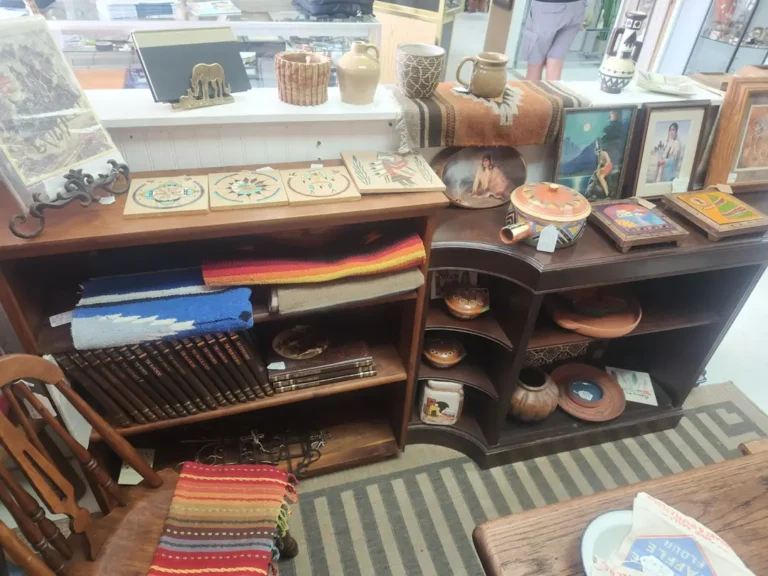Shelves displaying Native American pottery and woven items