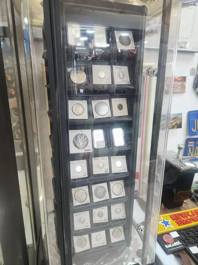 Display case filled with collectible coins and premium coin holders