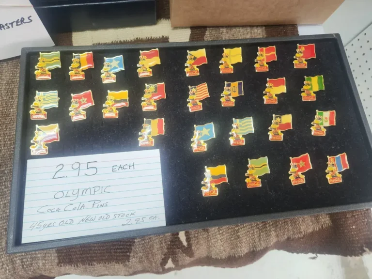 Display case with Coca-Cola Olympic collector pins