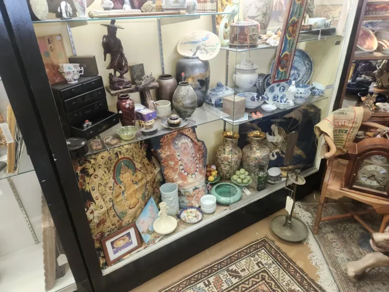 Glass display case brimming with coins and collectibles