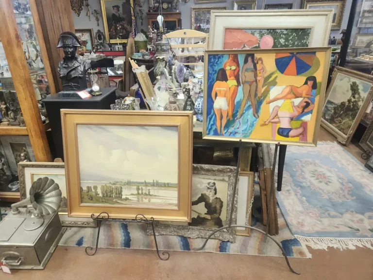 Room adorned with vintage Western oil paintings