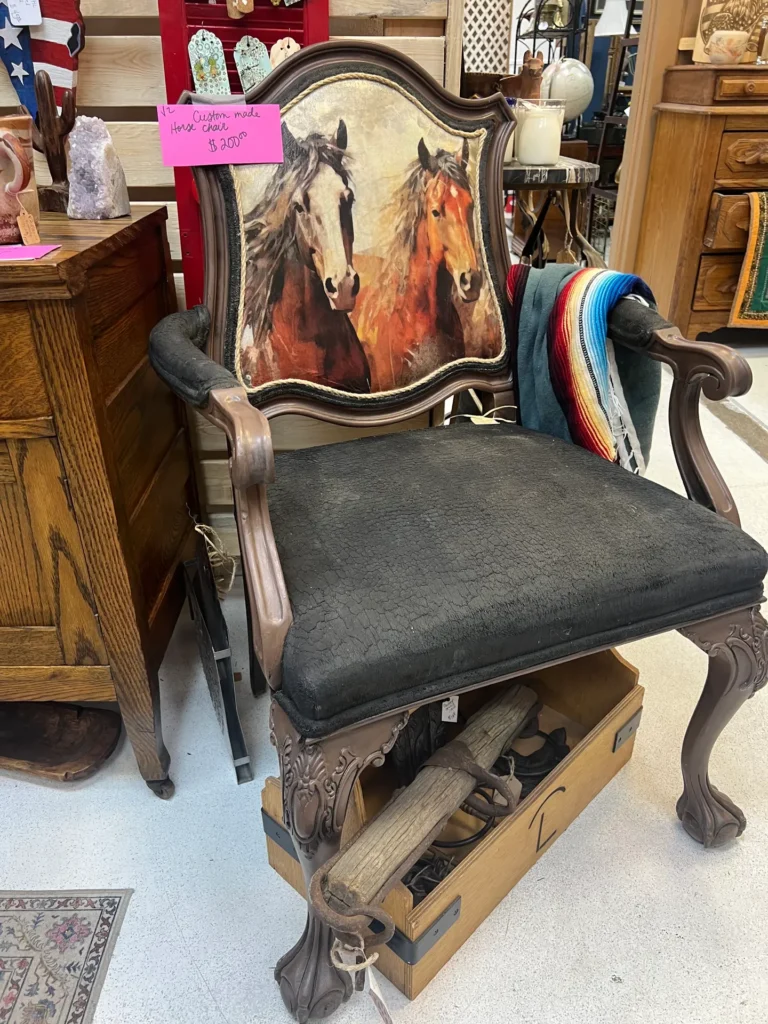 Rustic wooden armchair with black cushion and hand-painted backrest