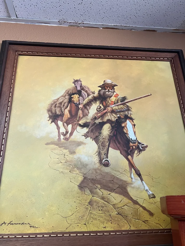 Vibrant painting of a rugged frontiersman with rifle